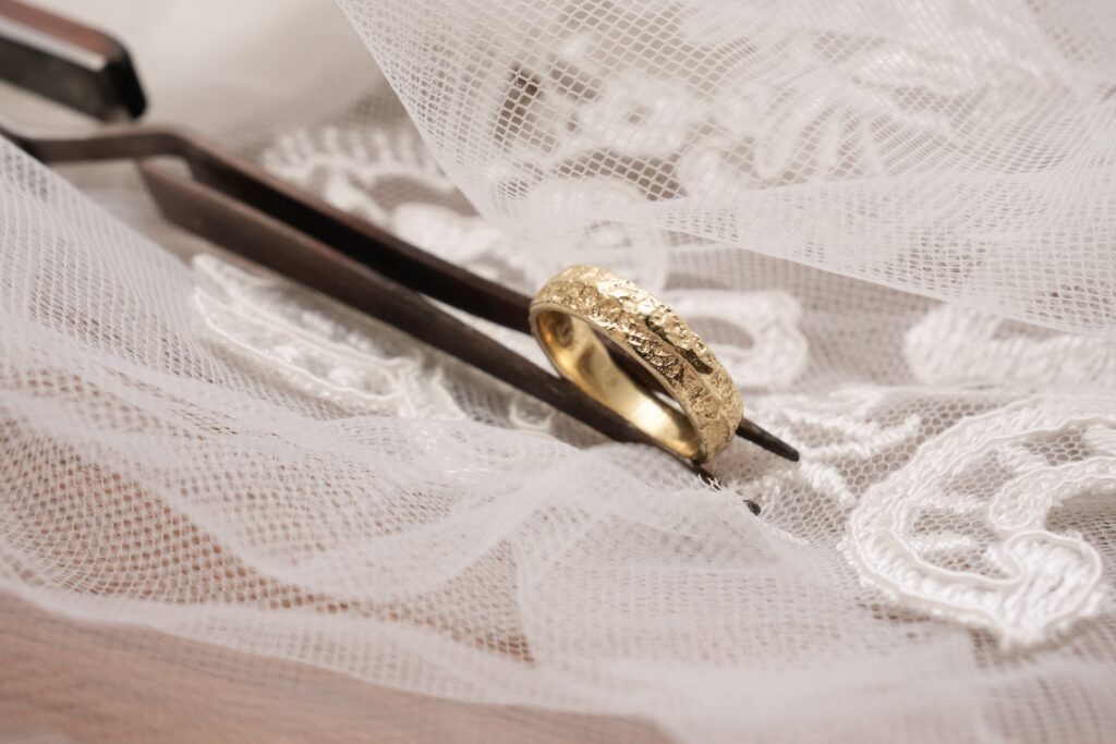 Frosted wedding ring in 14 karat yellow gold with a textured surface from sand casting
