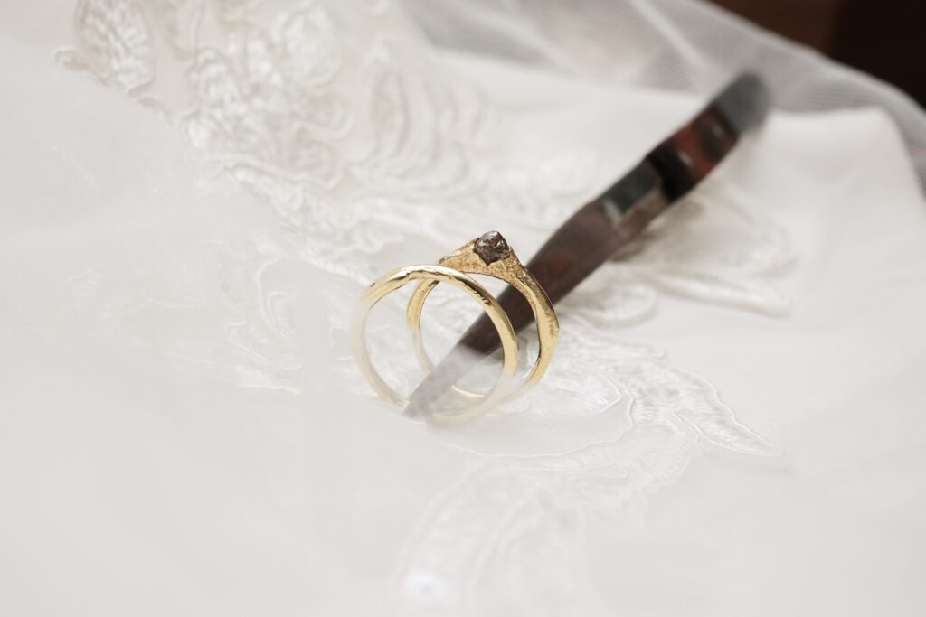 Mingle and Raw wedding rings in 14 karat yellow gold with organic shapes and raw diamond
